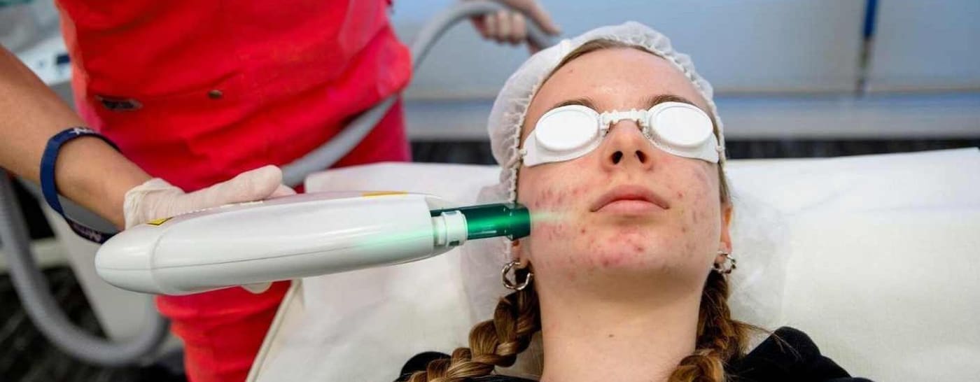 A practitioner performing a laser skin treatment — the advanced skills our team trains towards